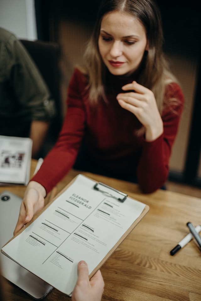 woman in interview with resume