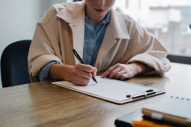 man writing resume