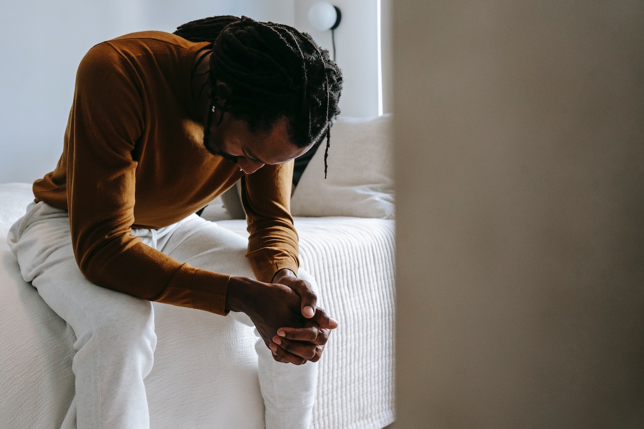 man praying for forgiveness