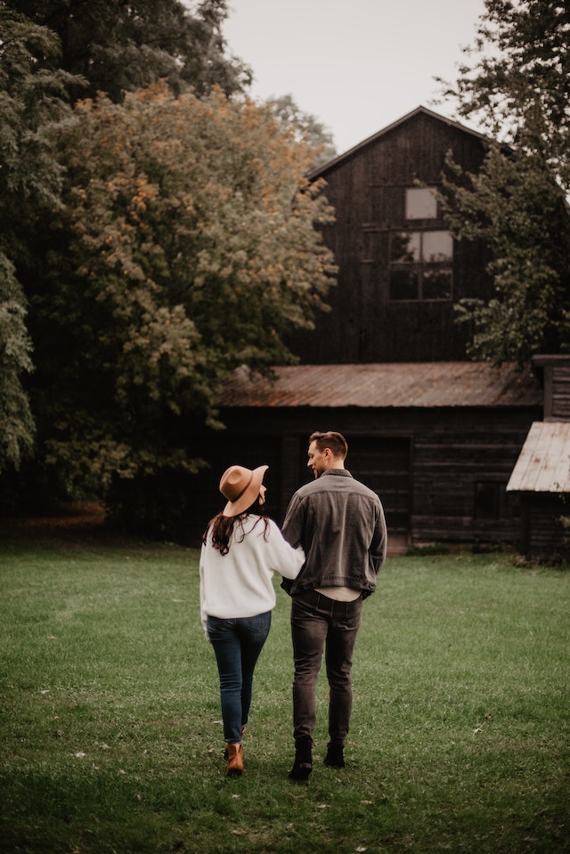 married couple walking in the park